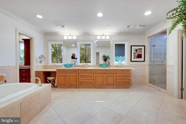 full bath with crown molding, vanity, a shower stall, visible vents, and a bath