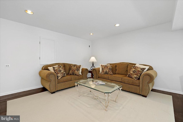 living room with baseboards, recessed lighting, and wood finished floors