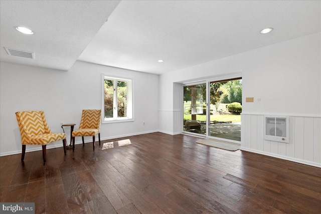 unfurnished room featuring wood-type flooring, recessed lighting, visible vents, and a wealth of natural light