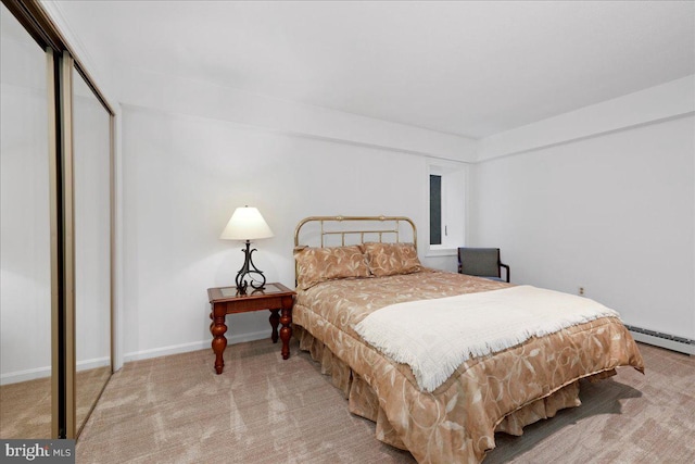 bedroom featuring carpet floors, baseboards, and a closet