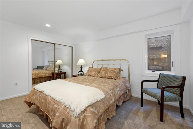 bedroom with carpet floors, recessed lighting, baseboards, and a closet