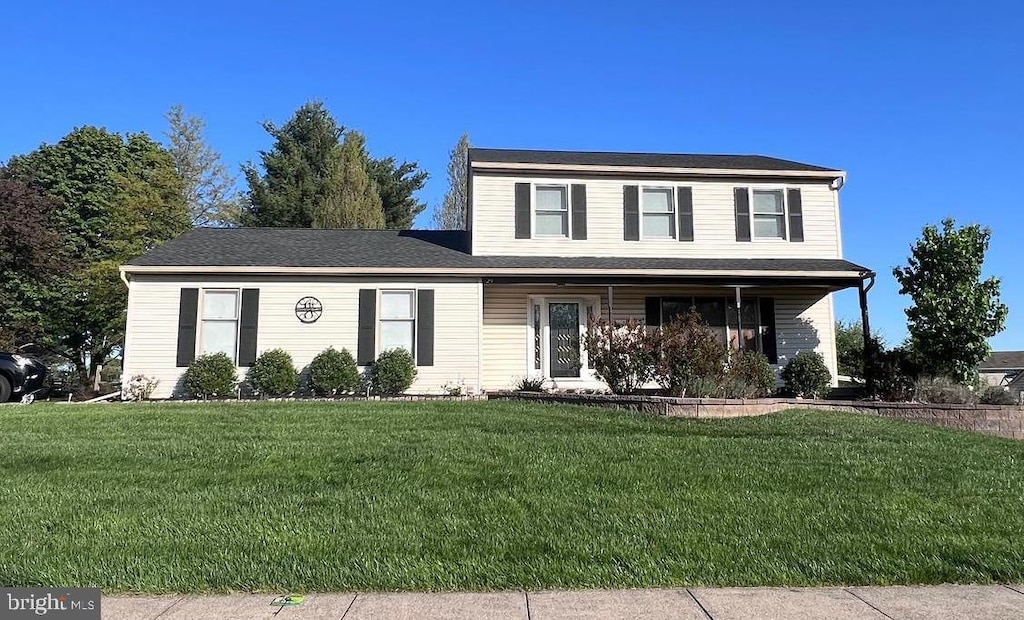 29 Castlewood Dr, Chalfont, PA 18914 - traditional-style house featuring a front lawn and covered porch