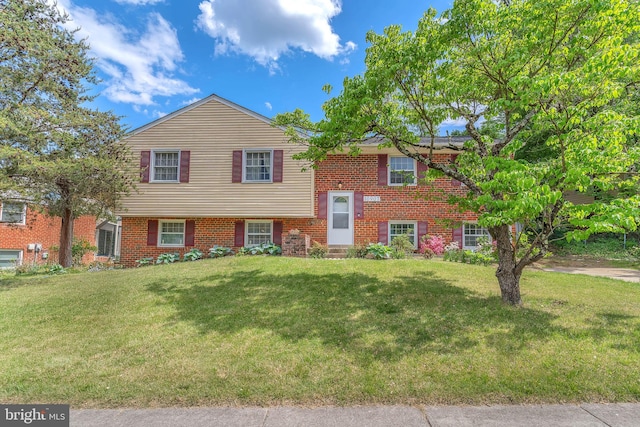 10907 Wharton Dr, Upper Marlboro, MD 20774 - split foyer home with a front lawn and brick siding