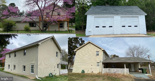exterior space featuring a detached garage, an outbuilding, and a porch