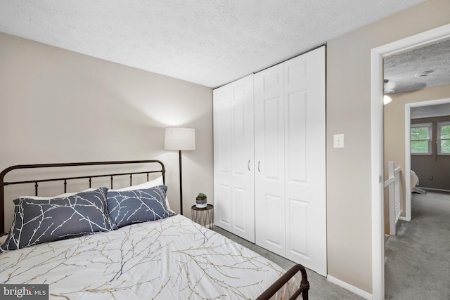 8140 Willowdale Ct, Springfield, VA 22153 - bedroom featuring a textured ceiling, carpet, a closet, and baseboards