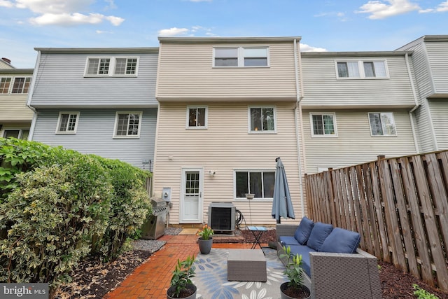 8140 Willowdale Ct, Springfield, VA 22153 - rear view of property with central AC, outdoor lounge area, a fenced backyard, and a patio