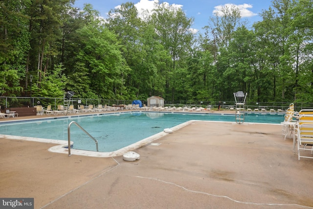 8140 Willowdale Ct, Springfield, VA 22153 - community pool featuring fence, a patio area, a shed, and an outbuilding