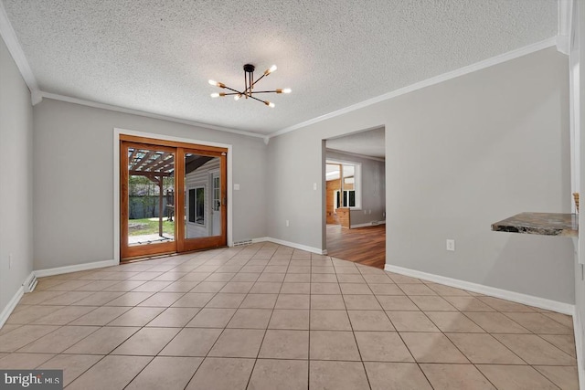 empty room with a textured ceiling and ornamental molding