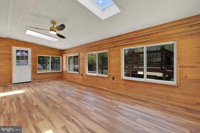 interior space with plenty of natural light and a skylight