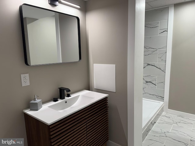bathroom with vanity, baseboards, a stall shower, and marble finish floor
