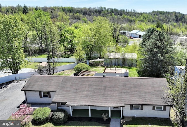 aerial view featuring a forest view