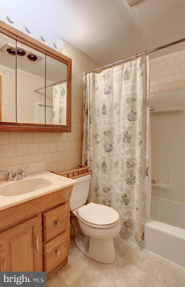 full bath with tile patterned flooring, shower / tub combo, toilet, and vanity