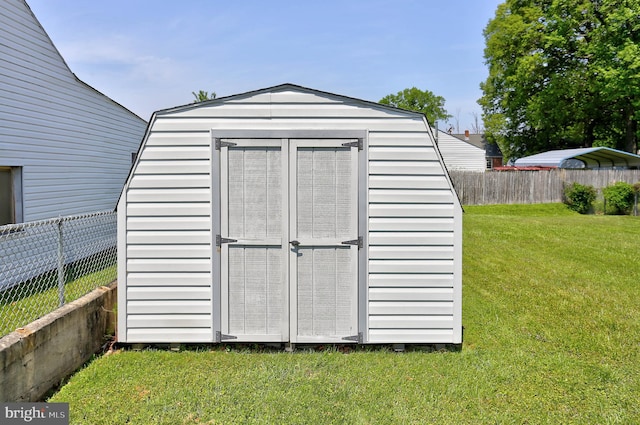 view of shed featuring a fenced backyard