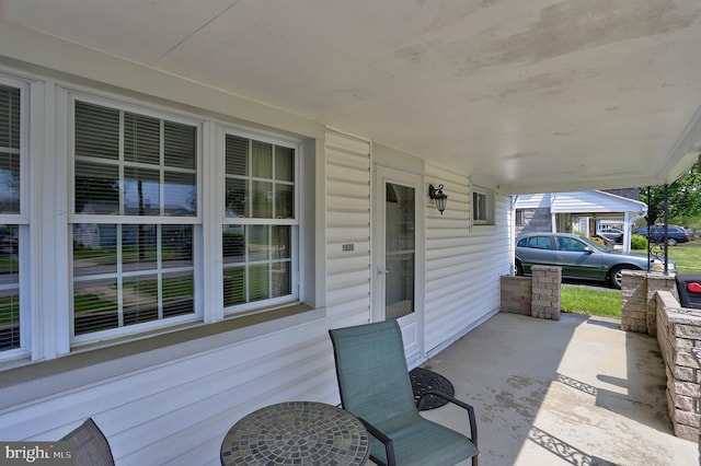 view of patio / terrace featuring a carport
