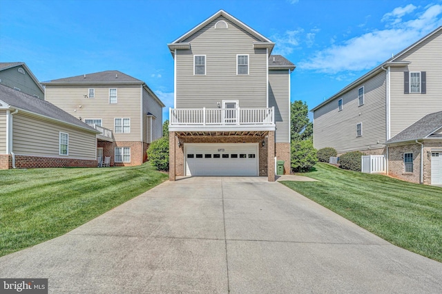 view of front of house featuring a garage, driveway, a front lawn, and brick siding