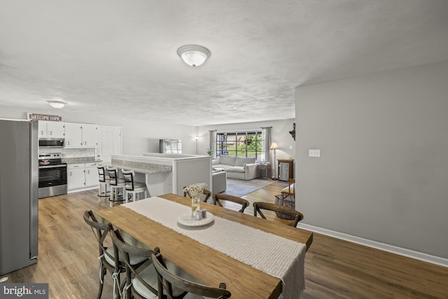 1004 Marietta Ave, Hanover, PA 17331 - dining room with light wood-style floors and baseboards