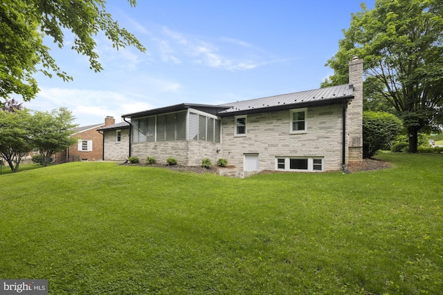 1004 Marietta Ave, Hanover, PA 17331 - back of property with a chimney, stone siding, a yard, and metal roof
