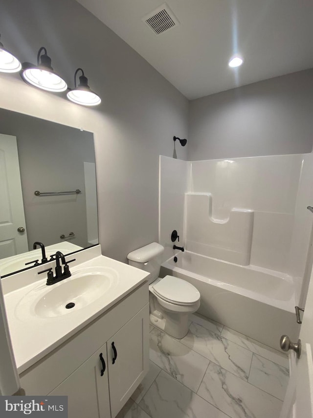 full bath with visible vents, vanity, toilet, marble finish floor, and shower / bathtub combination