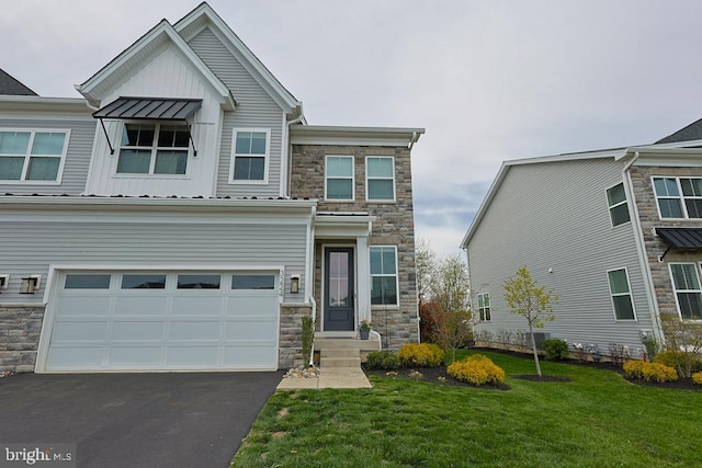 craftsman-style house with board and batten siding, an attached garage, stone siding, and aphalt driveway