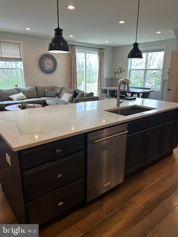 kitchen with a wealth of natural light, a sink, and dishwasher