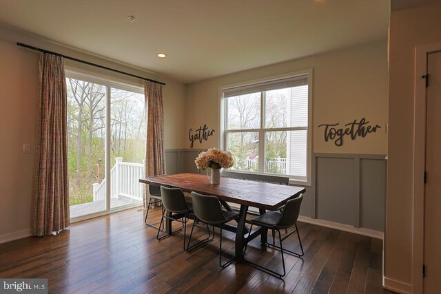 dining area with a healthy amount of sunlight and wainscoting