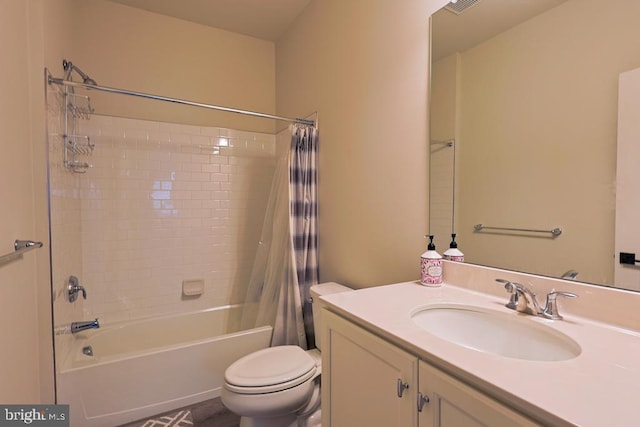 bathroom with vanity, shower / tub combo with curtain, and toilet