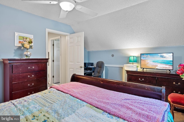bedroom featuring a ceiling fan, a textured ceiling, and vaulted ceiling