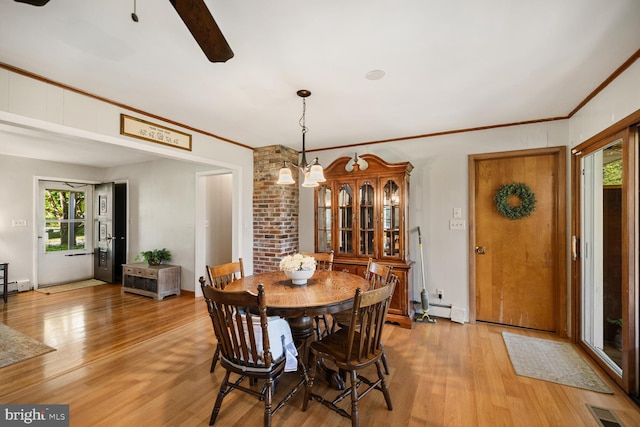 196 Taylortown Rd, Edinburg, VA 22824 - dining area with ornamental molding, light wood-style floors, a baseboard radiator, and a ceiling fan