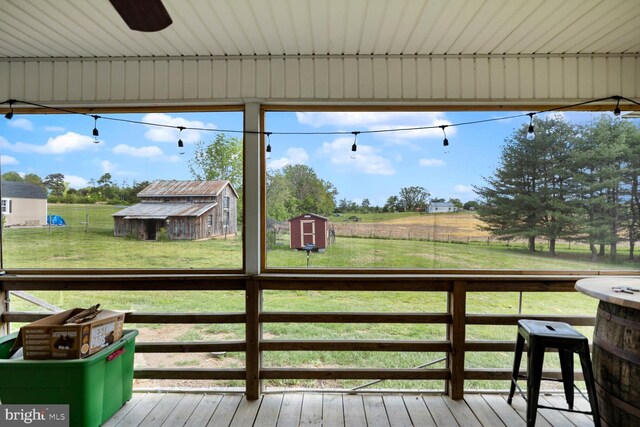 196 Taylortown Rd, Edinburg, VA 22824 - wooden deck featuring a shed, a lawn, an outdoor structure, and a view of rural / pastoral area