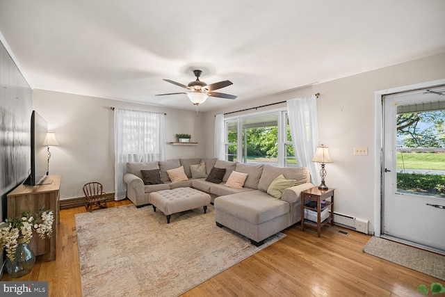 196 Taylortown Rd, Edinburg, VA 22824 - living area with a ceiling fan, light wood-style floors, and a baseboard heating unit
