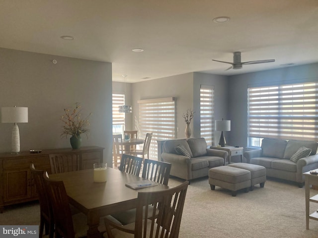 dining area with recessed lighting, ceiling fan, and light carpet