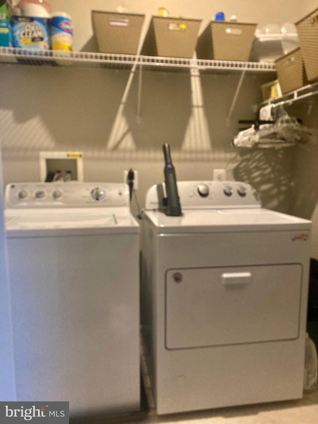 laundry area with laundry area and independent washer and dryer