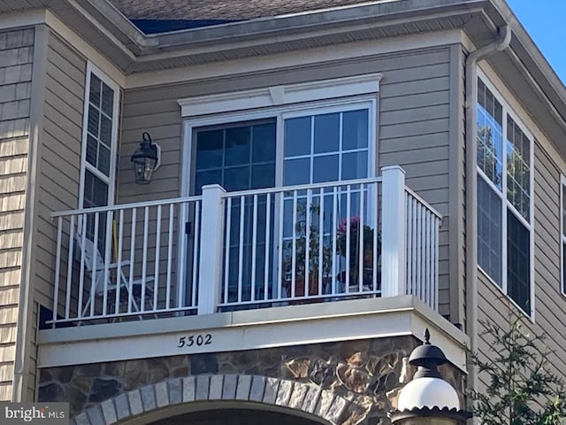 5302 Knox Ct Unit 5302, Warwick, PA 18974 - view of property exterior featuring a shingled roof and a balcony