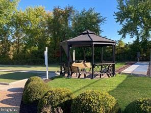 view of community with a lawn and a gazebo