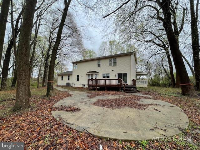 back of property featuring a deck