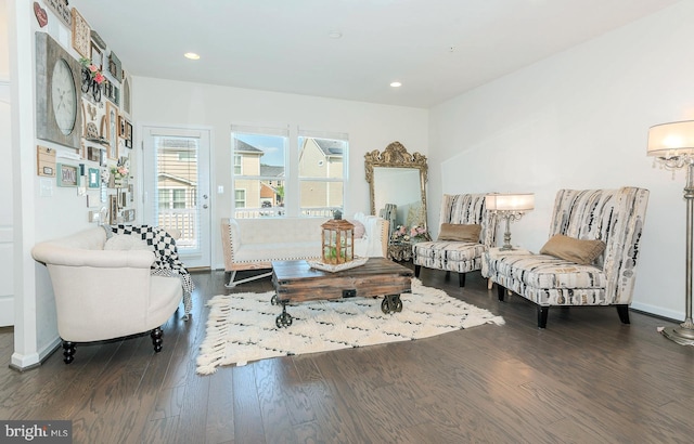living room with baseboards, recessed lighting, and wood finished floors
