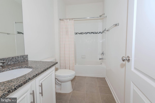 full bathroom featuring tile patterned flooring, shower / bath combo, vanity, baseboards, and toilet