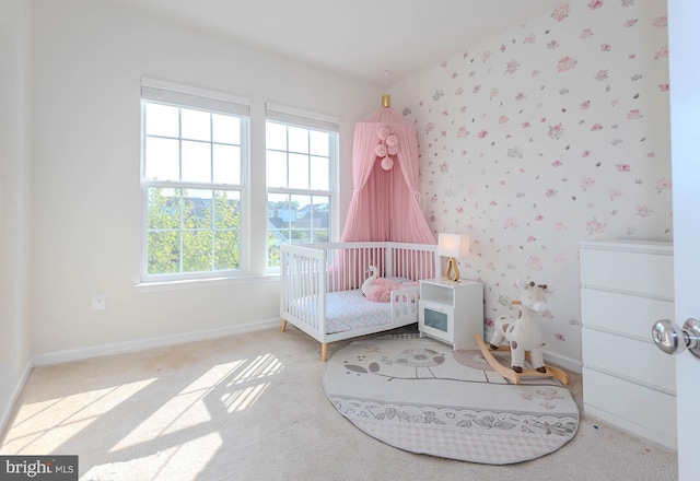 bedroom with baseboards, carpet flooring, and multiple windows