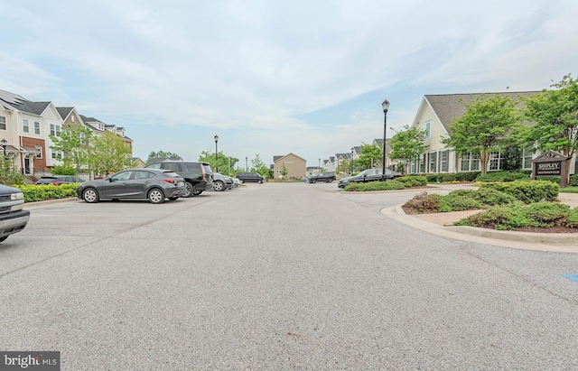 view of street with a residential view and street lighting