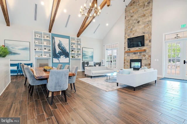 dining area featuring high vaulted ceiling, a notable chandelier, beam ceiling, and visible vents