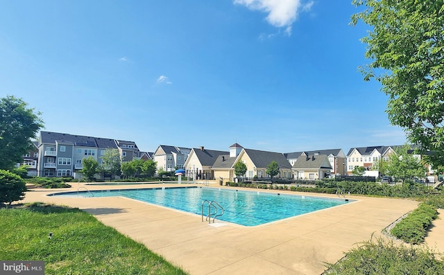 community pool featuring a residential view