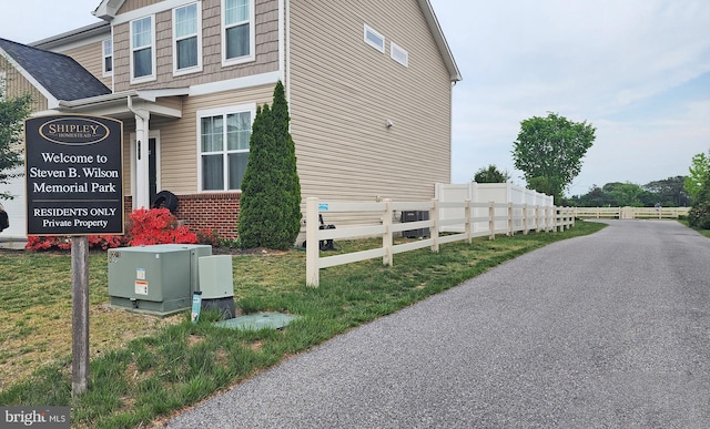 view of side of home with fence
