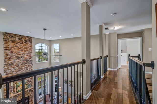 hallway featuring an upstairs landing, dark wood-type flooring, recessed lighting, and baseboards