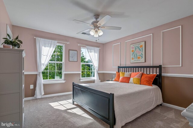 bedroom featuring carpet flooring, baseboards, and ceiling fan