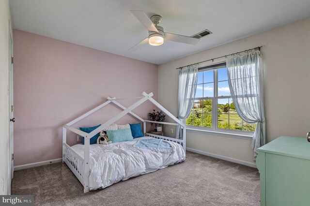 bedroom featuring carpet flooring, baseboards, and ceiling fan