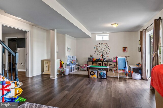 rec room with wood finished floors and baseboards