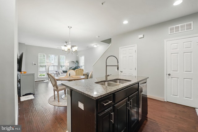 42783 Keiller Ter Unit 13A, Ashburn, VA 20147 - kitchen with a sink, a chandelier, dishwasher, dark wood-style floors, and light stone counters