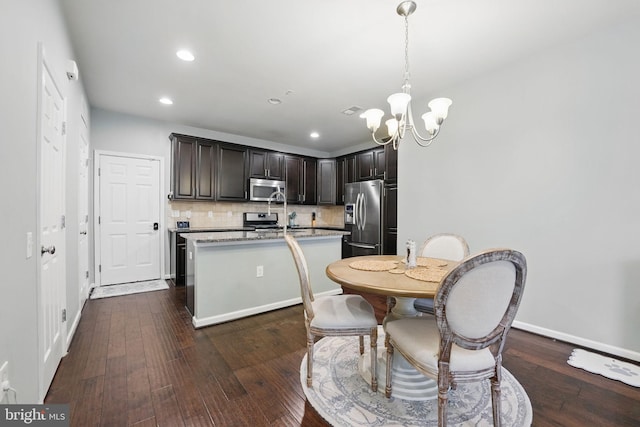 42783 Keiller Ter Unit 13A, Ashburn, VA 20147 - kitchen featuring stainless steel appliances, a chandelier, dark wood finished floors, backsplash, and recessed lighting