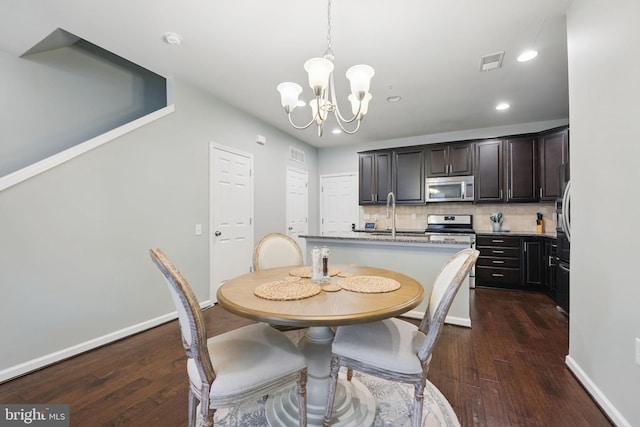 42783 Keiller Ter Unit 13A, Ashburn, VA 20147 - dining space with a chandelier, dark wood-style floors, recessed lighting, and baseboards