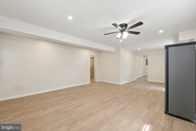 interior space featuring recessed lighting, baseboards, ceiling fan, and light wood-type flooring